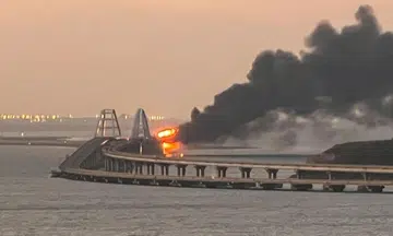 Blasts, raging fire wreck 'prestige' bridge vital to Putin's plans