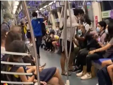 Man with mask down shouts on MRT he has 'agenda' and is 'message from god'