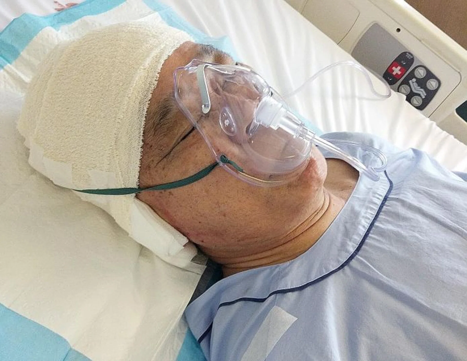 SHOCKING: A screen grab of the in-car camera video, which shows the taxi ramming into Mr Lee Yao Ji (above, in hospital).