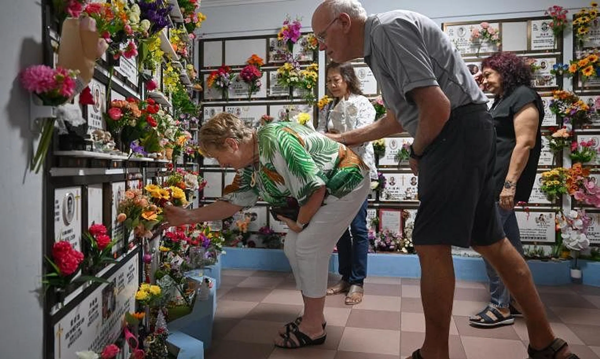 The visit to the columbarium on Dec 22 by Mrs Laurie Rands (left) and her husband marked a bittersweet end to their search for their amah. 