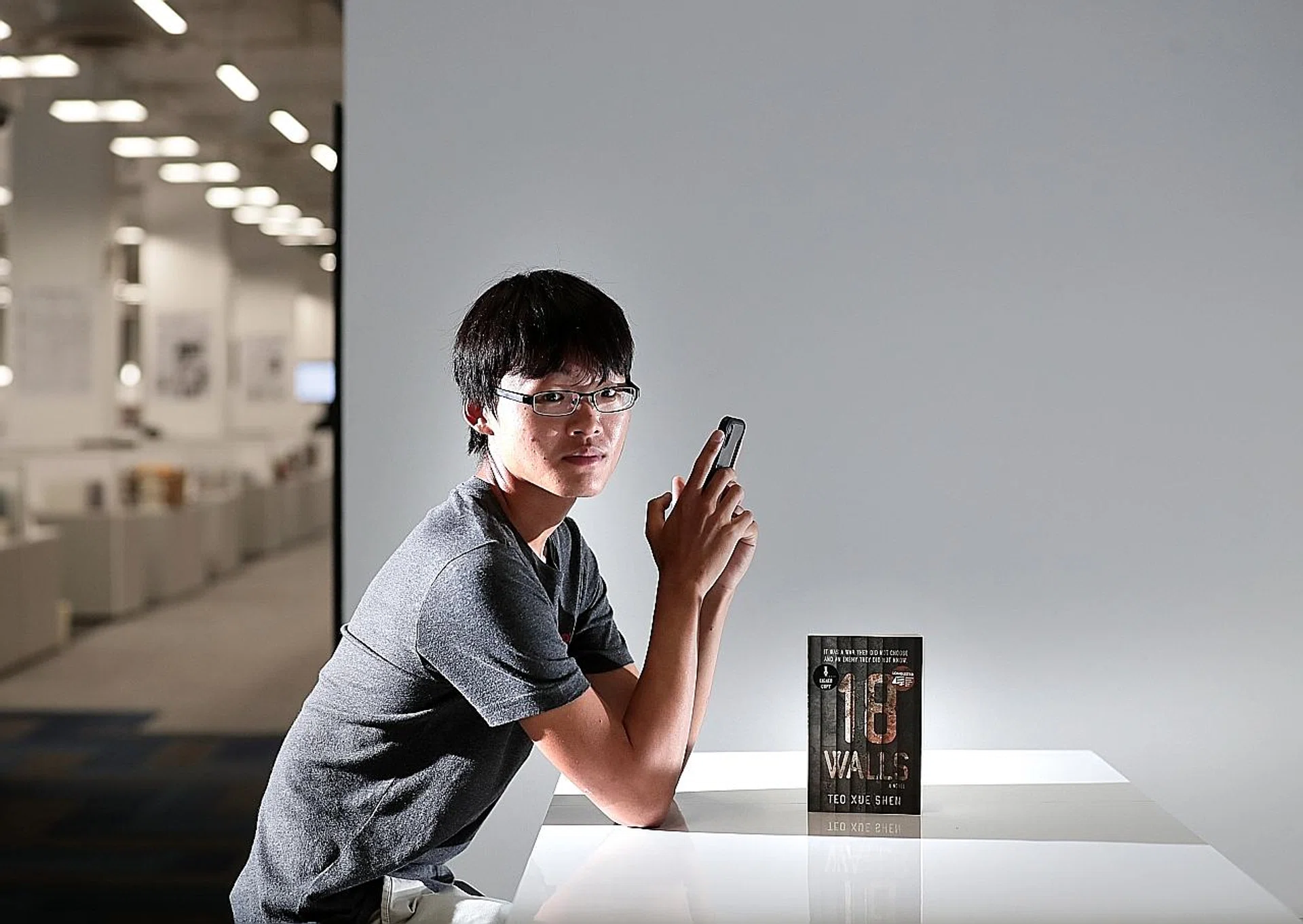 Mr Teo Xue Shen and his novel, 18 Walls. 