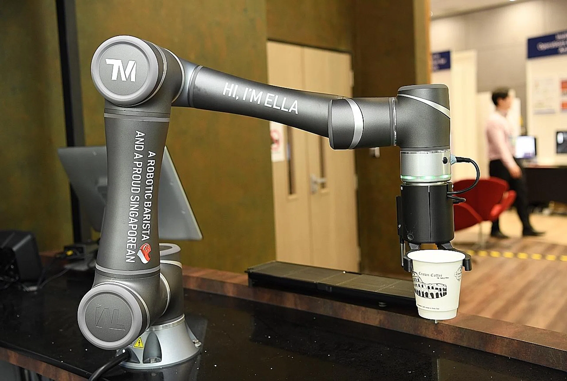 NUS' state-of-the-art building features a smart cafe where robot baristas can use facial recognition and machine learning to serve regular customers. 