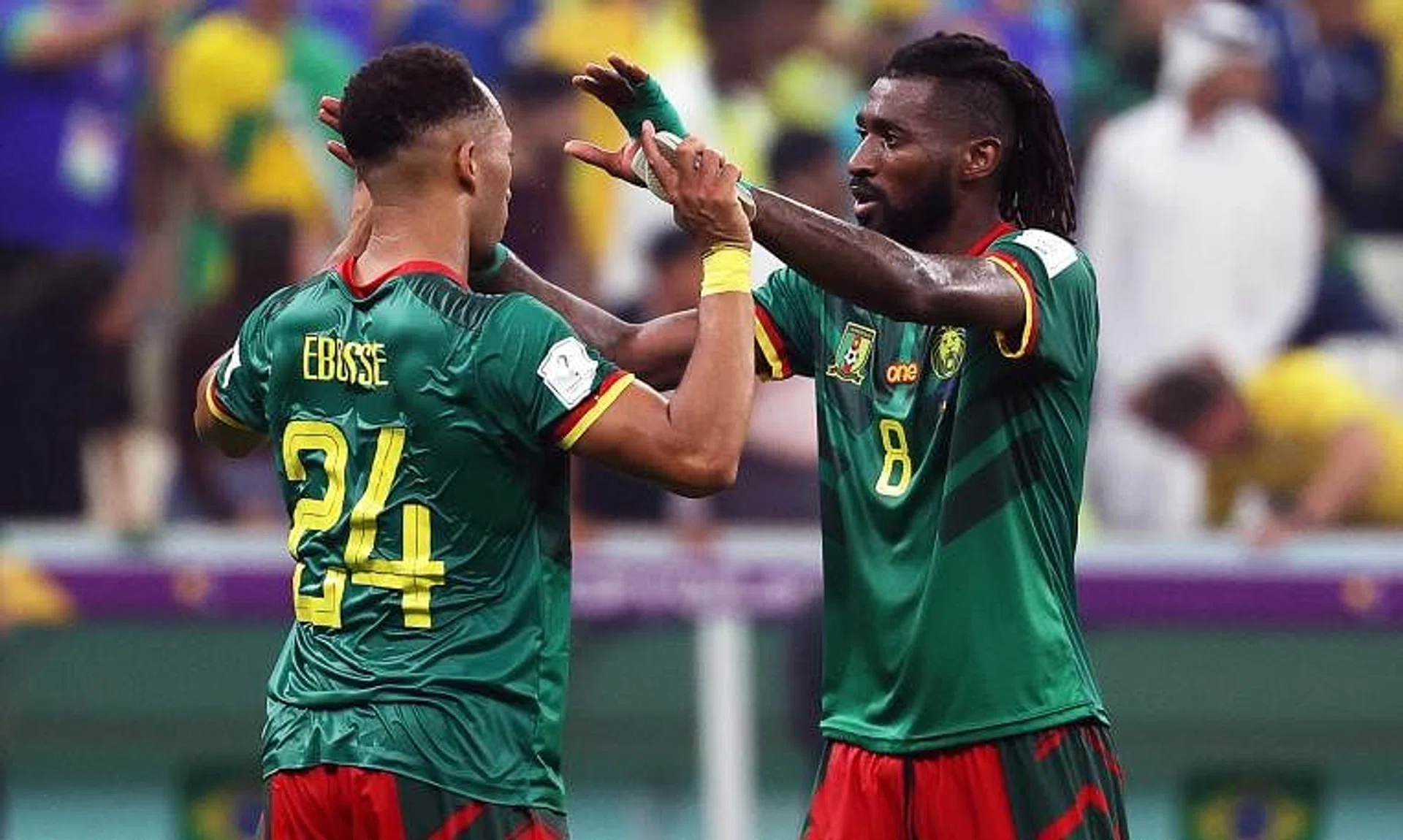 Cameroonian players Enzo Ebosse (left) and Andre-Frank Zambo Anguissa celebrate beating Brazil, despite not going through.