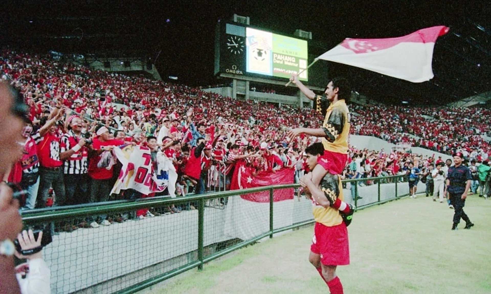 Kadir Yahaya carries vice-captain Malek Awab after Singapore beat Pahang in Malaysia Cup final on Dec 17, 1994.