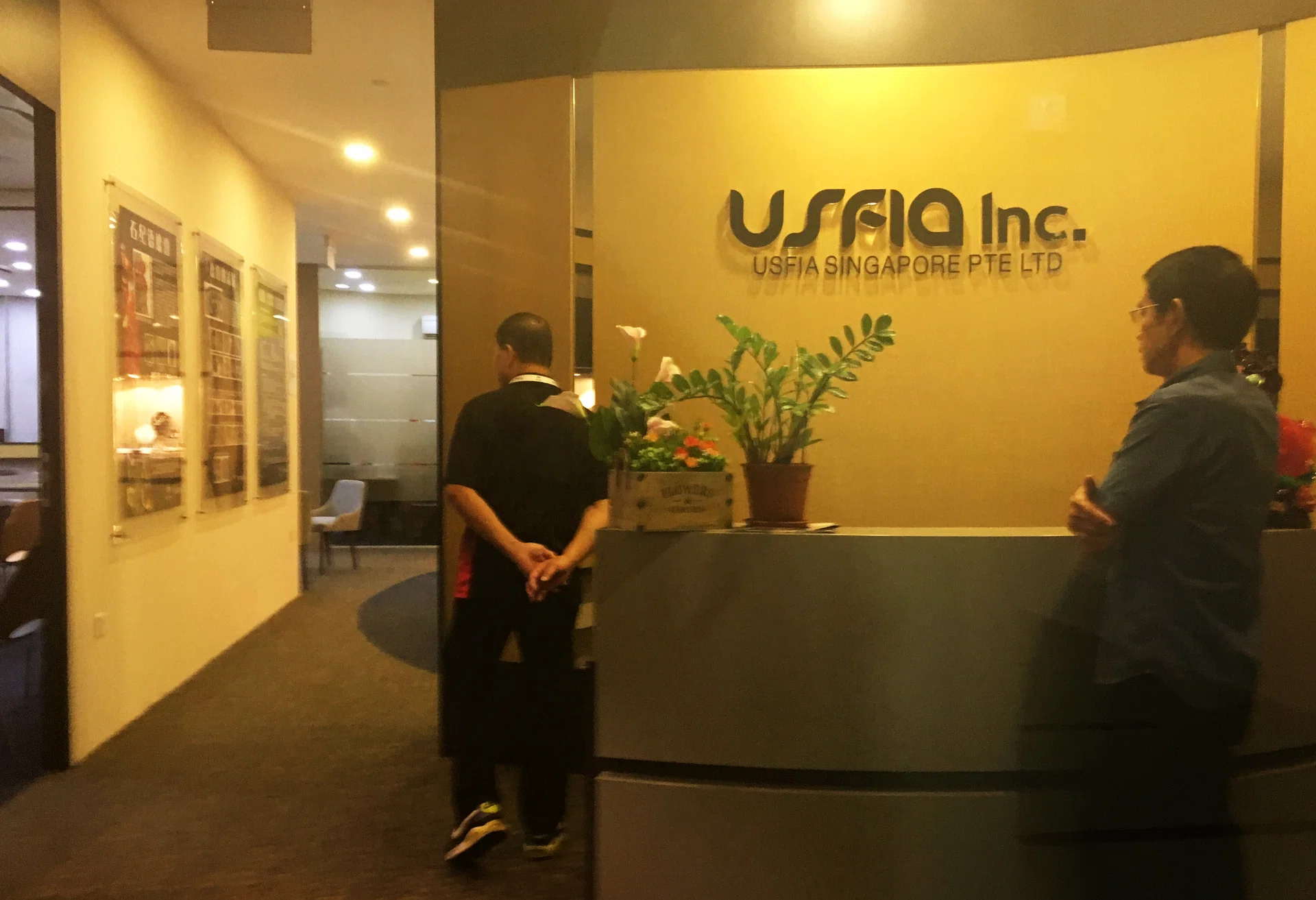 Staff members at USFIA Singapore manning the reception area.