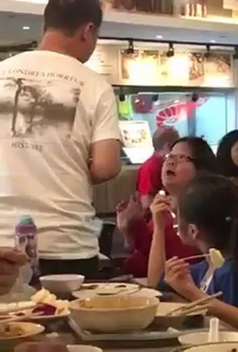 Woman who ranted at deaf cleaner says sorry