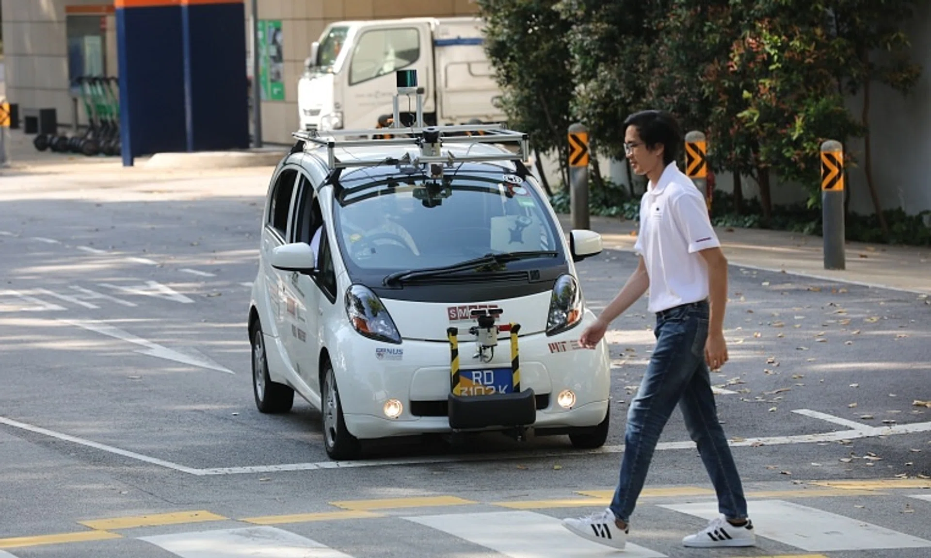 A self-driving electric vehicle being tested on the road in University Town at the National University of Singapore.