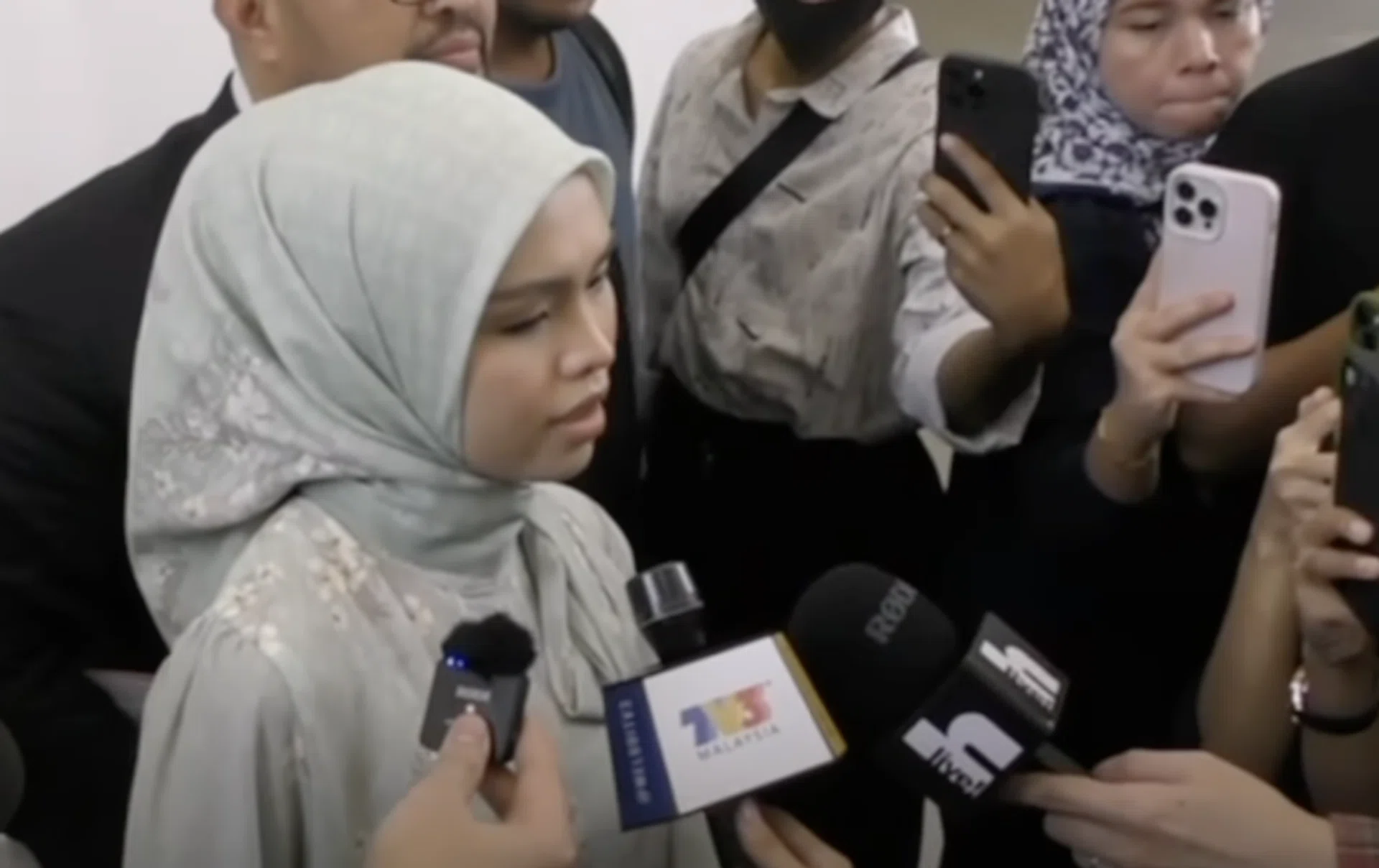 Bella Astillah speaking to local media outside the Syariah Court in Kuala Lumpur.