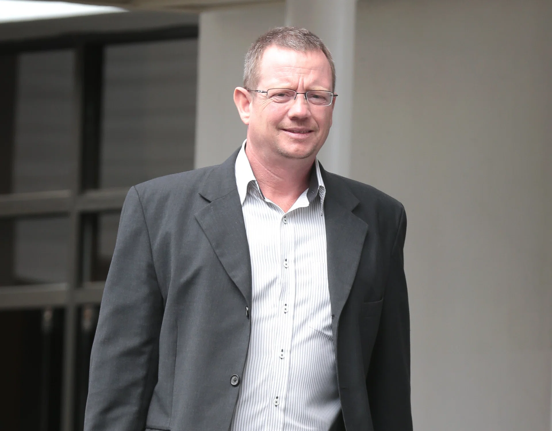 IT’S FINALLY OVER: A visibly relieved Arne Corneliussen leaving the State Courts yesterday. 