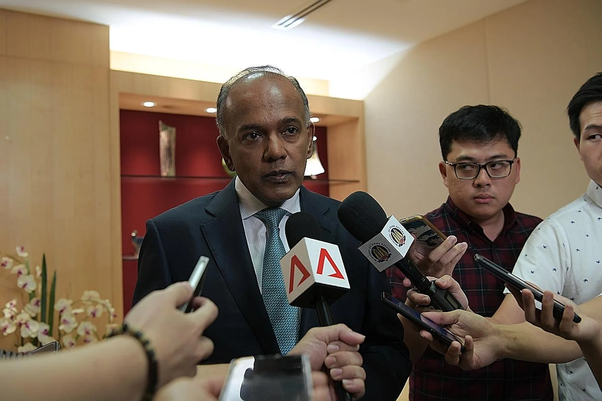 Home Affairs and Law Minister K. Shanmugam speaking to reporters about the Restriction Orders placed on a religious teacher and student for their radical views.