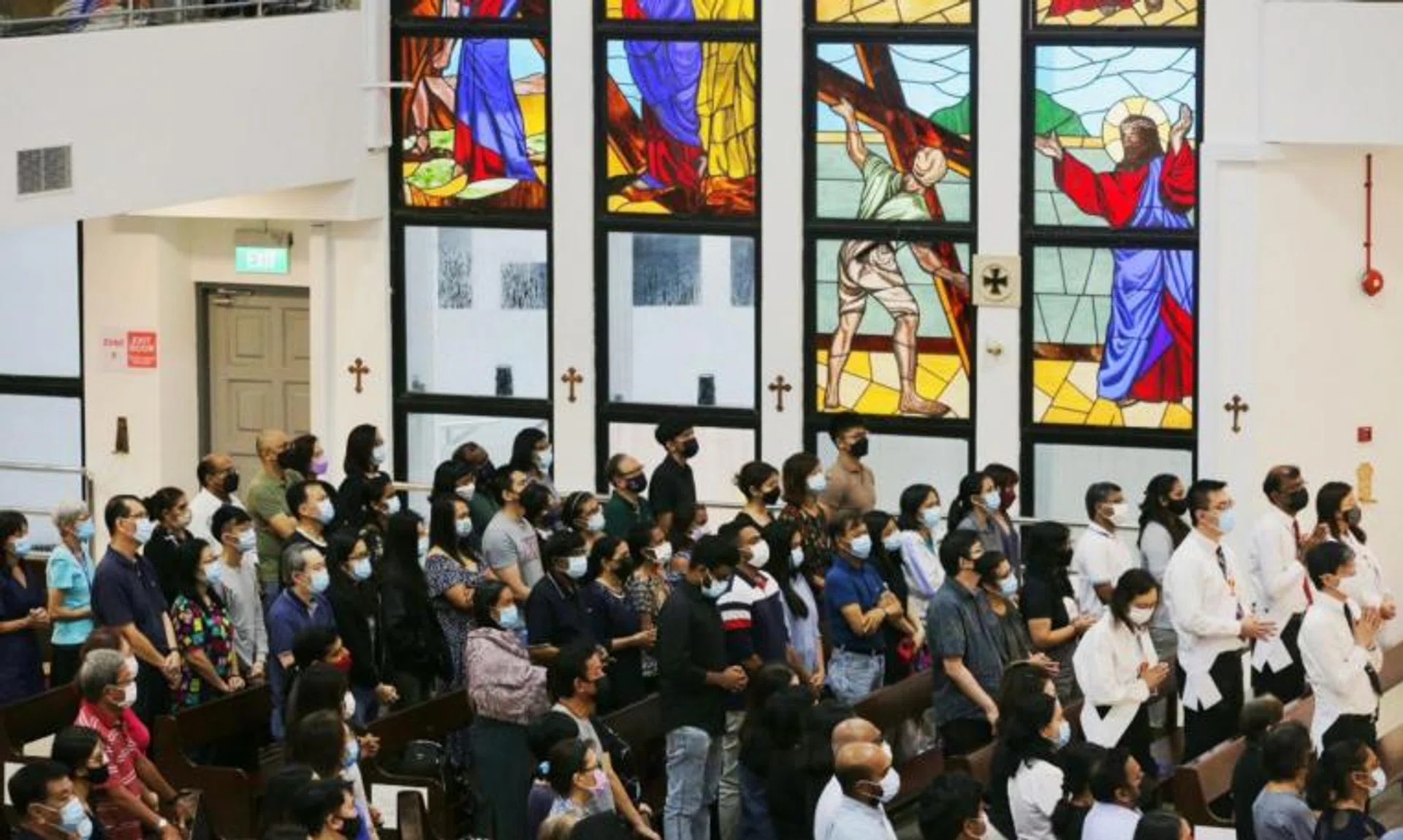 Catholics attend a Good Friday service at the Church of St Anthony of Padua in Woodlands on April 15, 2022.