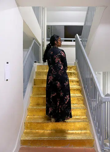 Art student's unapproved gold staircase sparks debate