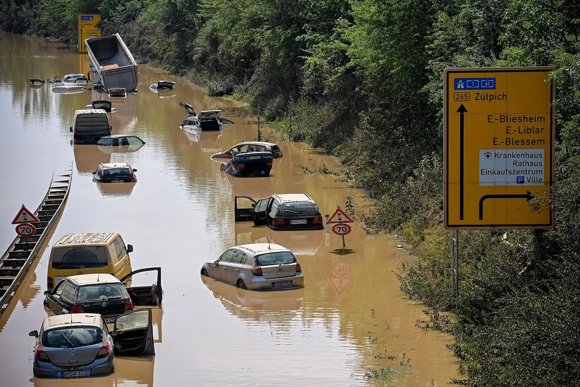 Wrecked cars and trucks flooded on the B265 federal highway in Erftstadt. Parts of western Germany were hit by heavy, continuous rain resulting in flash floods that destroyed buildings and swept away cars.