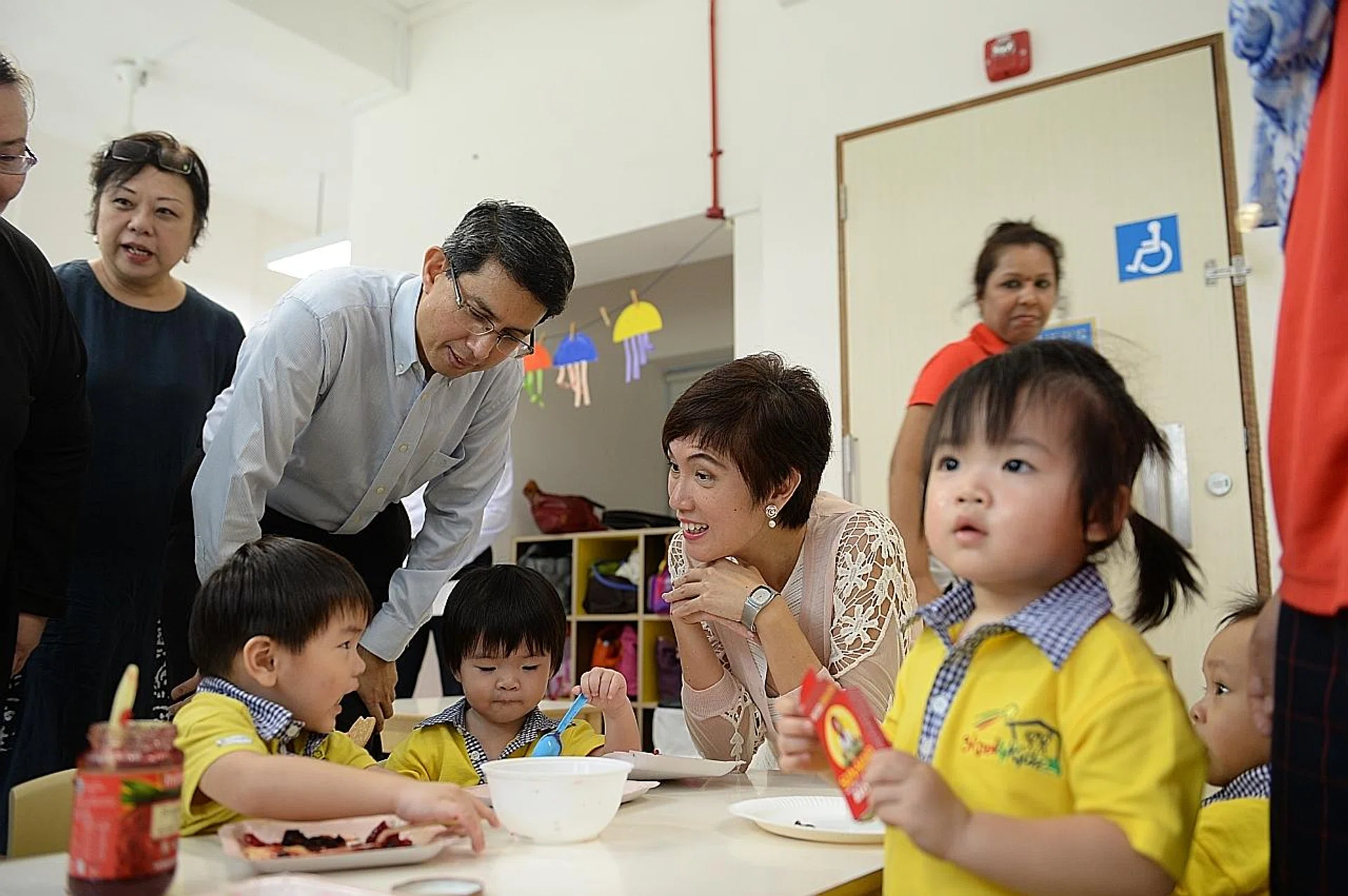 Parliamentary Secretary for Ministry of Social and Family Development Faishal Ibrahim and Senior Minister of State Josephine Teo, who overseas the National Population and Talent Division, at a Skool4kidz childcare centre in Tampines yesterday. 