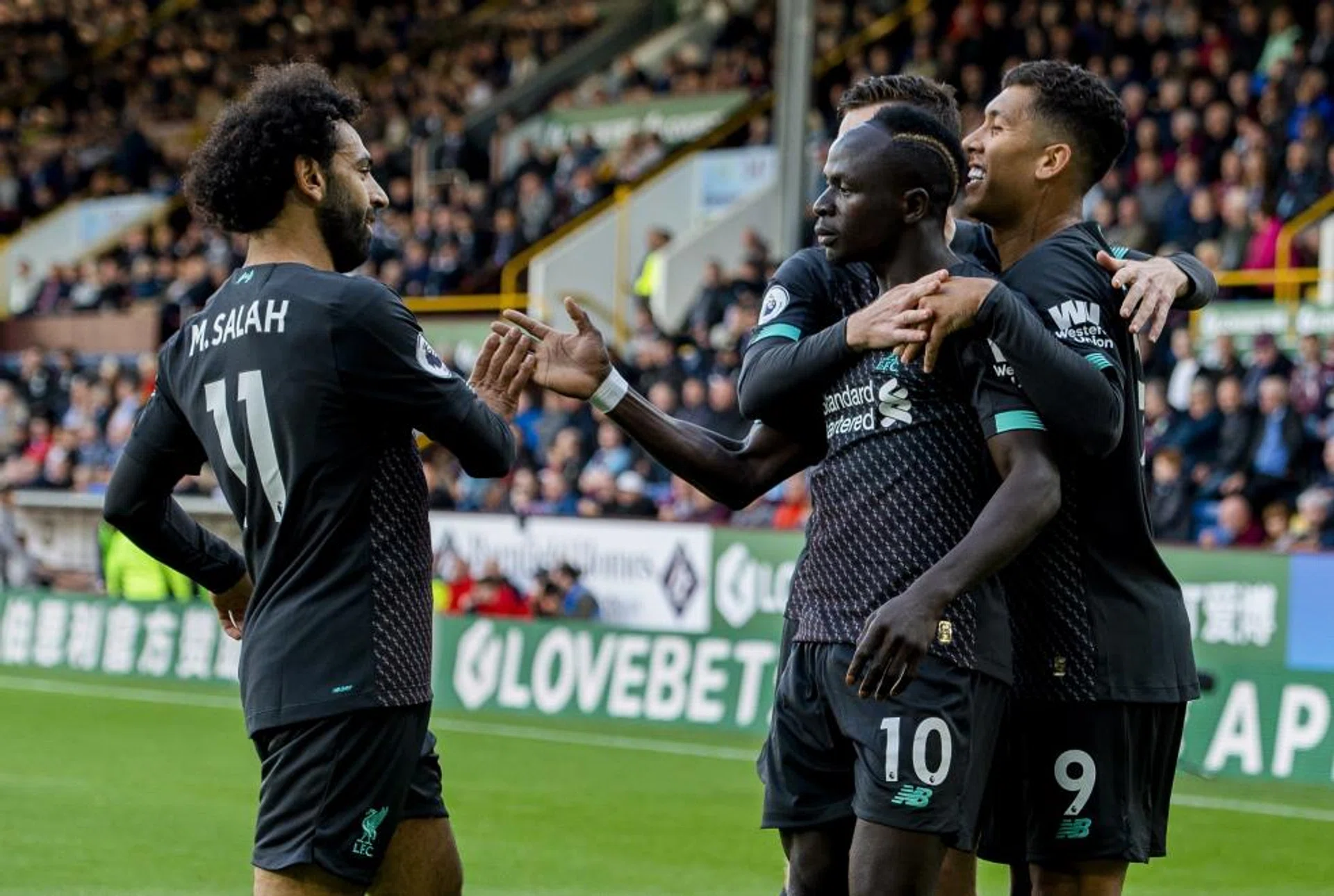 Mohamed Salah (left) joining in the celebrations after Sadio Mane scored Liverpool's second goal.