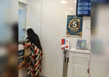 Woman asks for money at Joo Chiat then uses it to buy lottery, sparking online debate