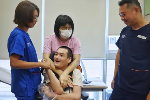 Mr Lucas Oon with (from left) assistant nurse clinician Kimberly Quek, his mother Vanessa Oon, and Dr Jeremy Lin.