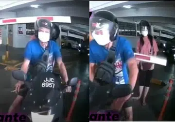 Biker tries to sneak out of carpark and barrier smacks pillion rider
