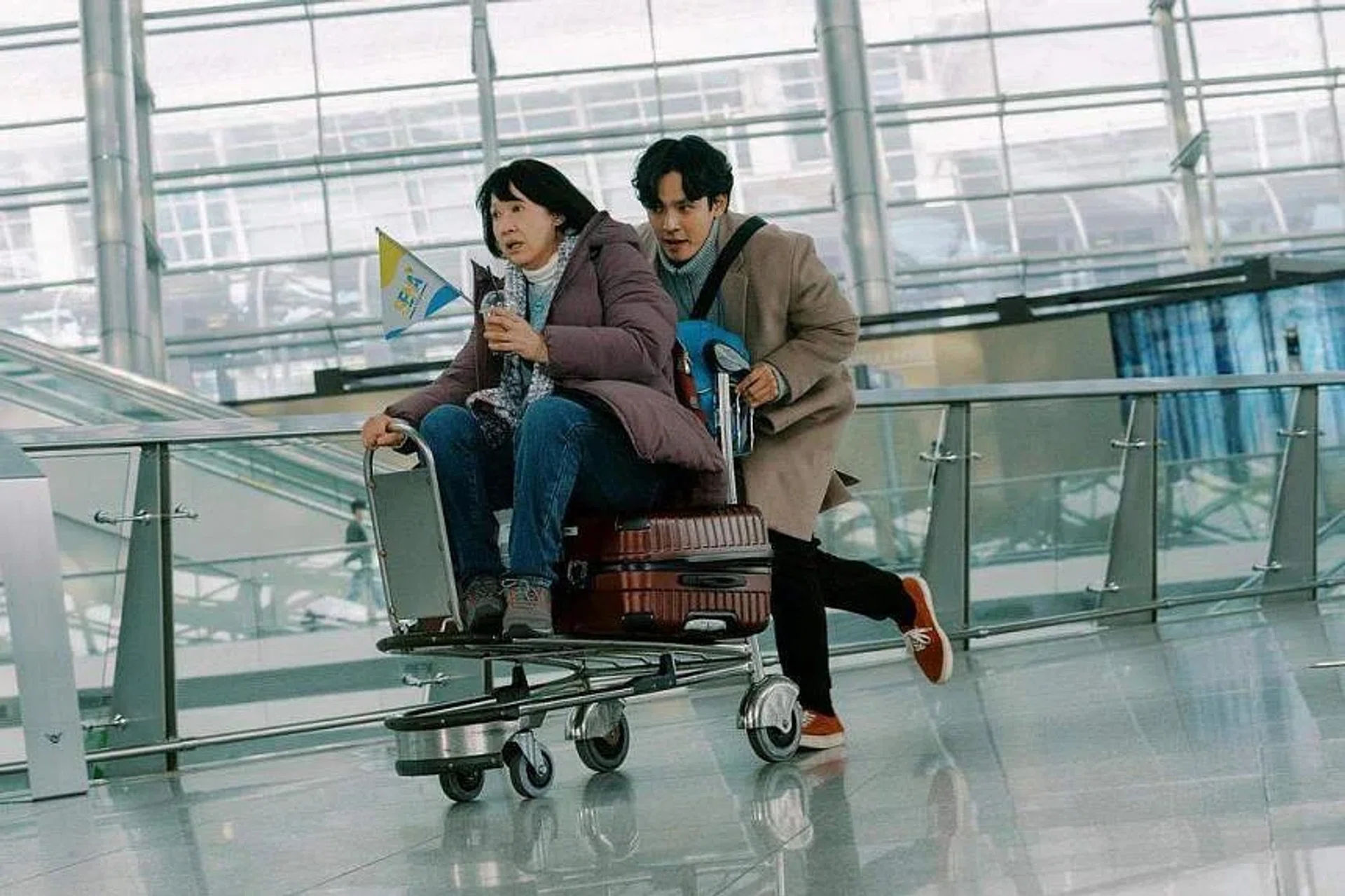 A still from the film Ajoomma starring Hong Huifang (left) and Kang Hyung-suk.