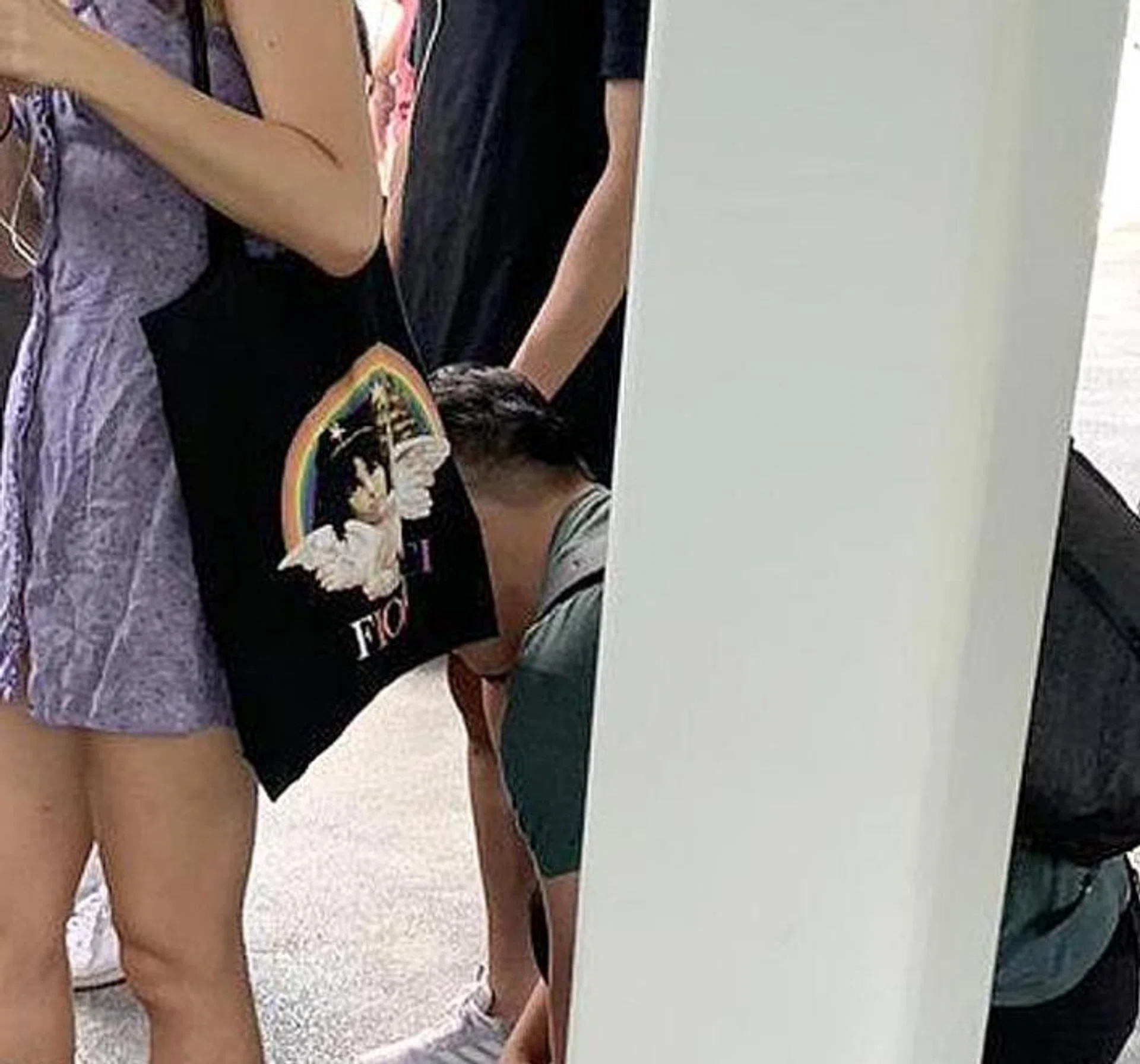 The man in the green shirt is alleged to have followed the NUS student and taken photos of her. 