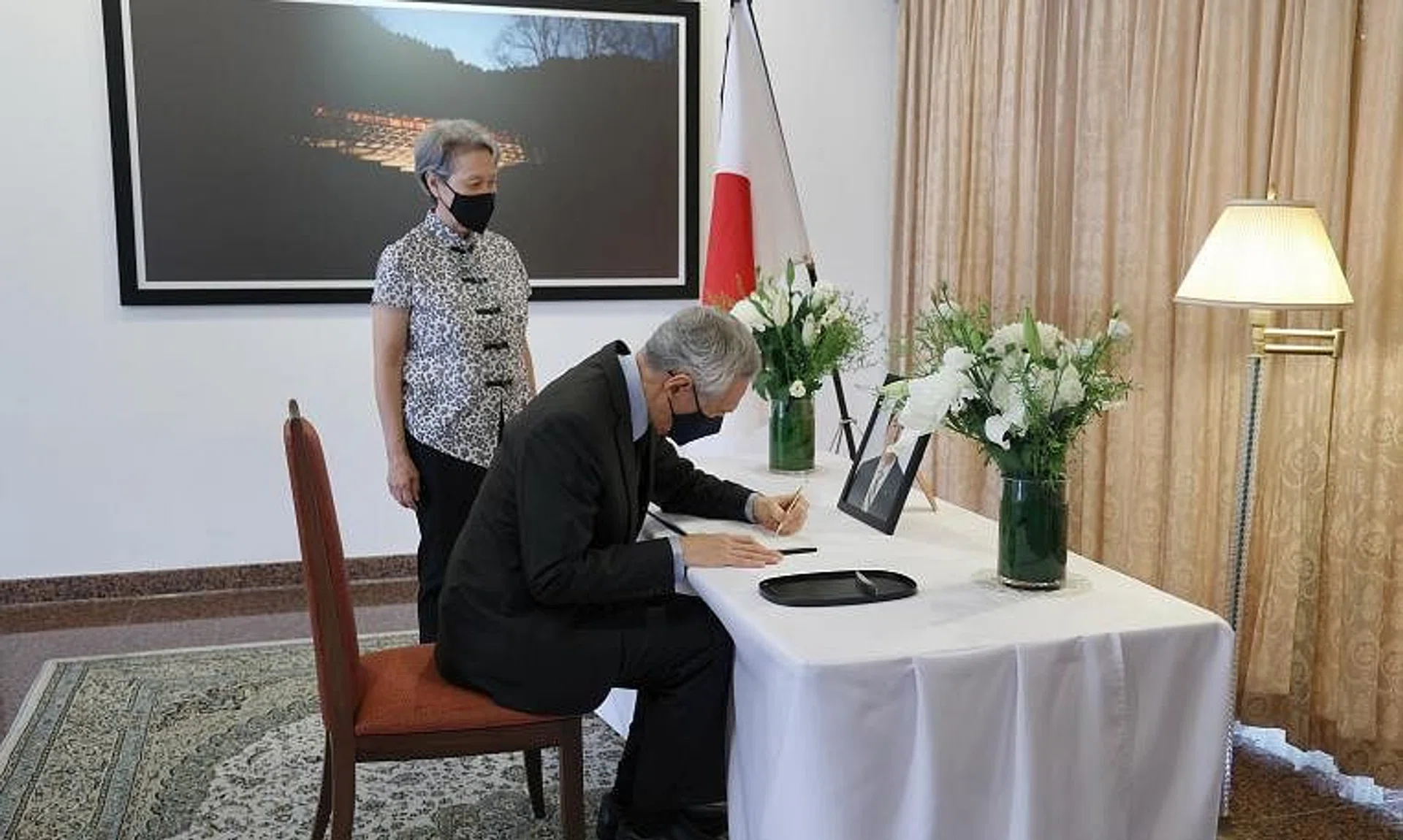 Prime Minister Lee Hsien Loong, accompanied by Mrs Lee, paid his respects and signed the condolence book for former Japan PM Shinzo Abe at the residence of Ambassador Jun Yamazaki on July 12, 2022.