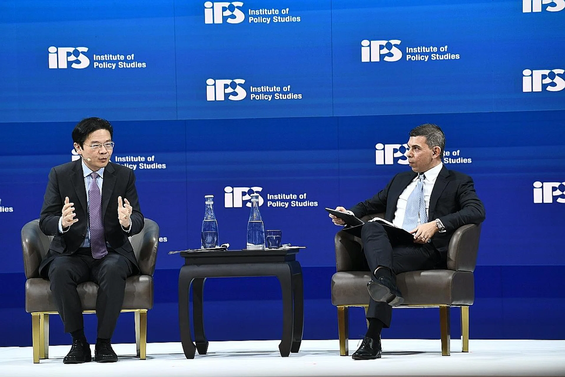 Education Minister Lawrence Wong speaking at a dialogue chaired by The Straits Times editor Warren Fernandez as part of the Institute of Policy Studies' Singapore Perspectives conference yesterday. 