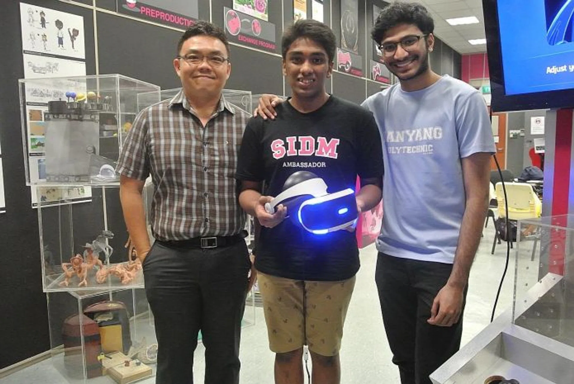 GAME ON: (From left) Mr Andrew Lam, course manager for the Dipoma in Game Development & Technology, with students Arun Ezekiel and Sri Sham Haran, at Nanyang Polytechnic's Games Resource Lab.
