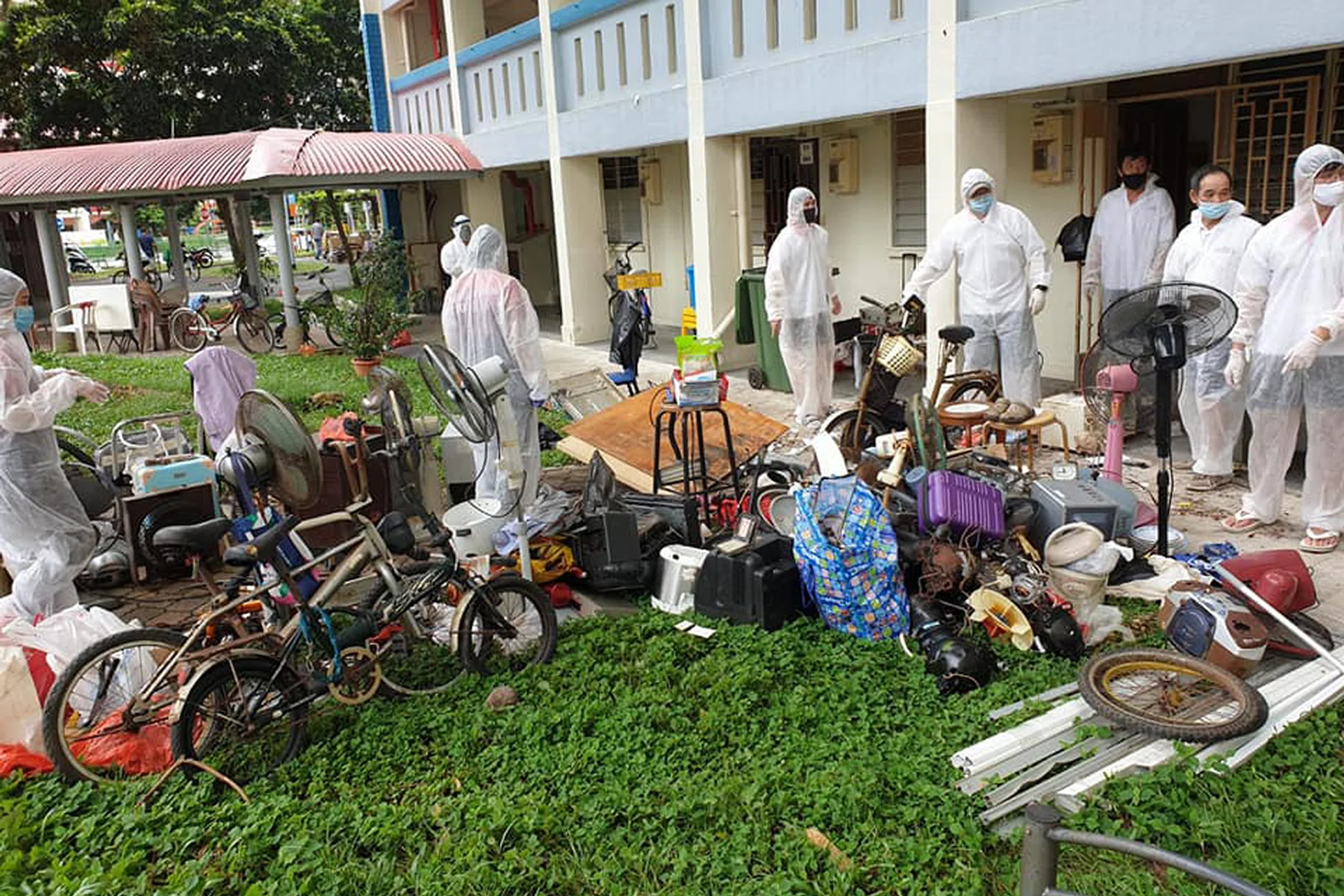 Volunteers from Keeping Hope Alive with some of the trash they helped remove from the 81-year-old's Toa Payoh flat. 