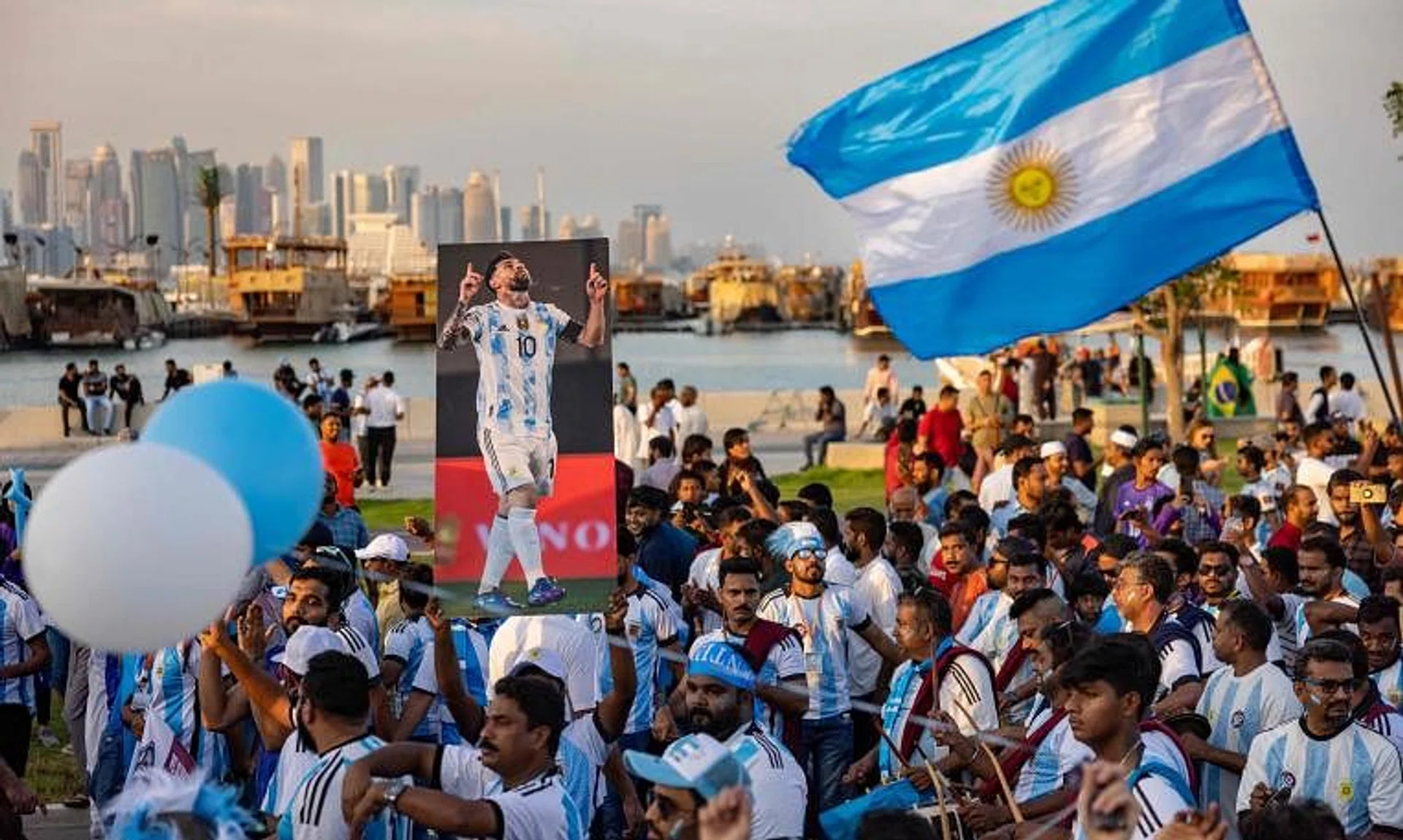 Football fans, many of them migrant workers from India, demonstrate their support for Argentina at the waterfront in Doha on Nov 11.