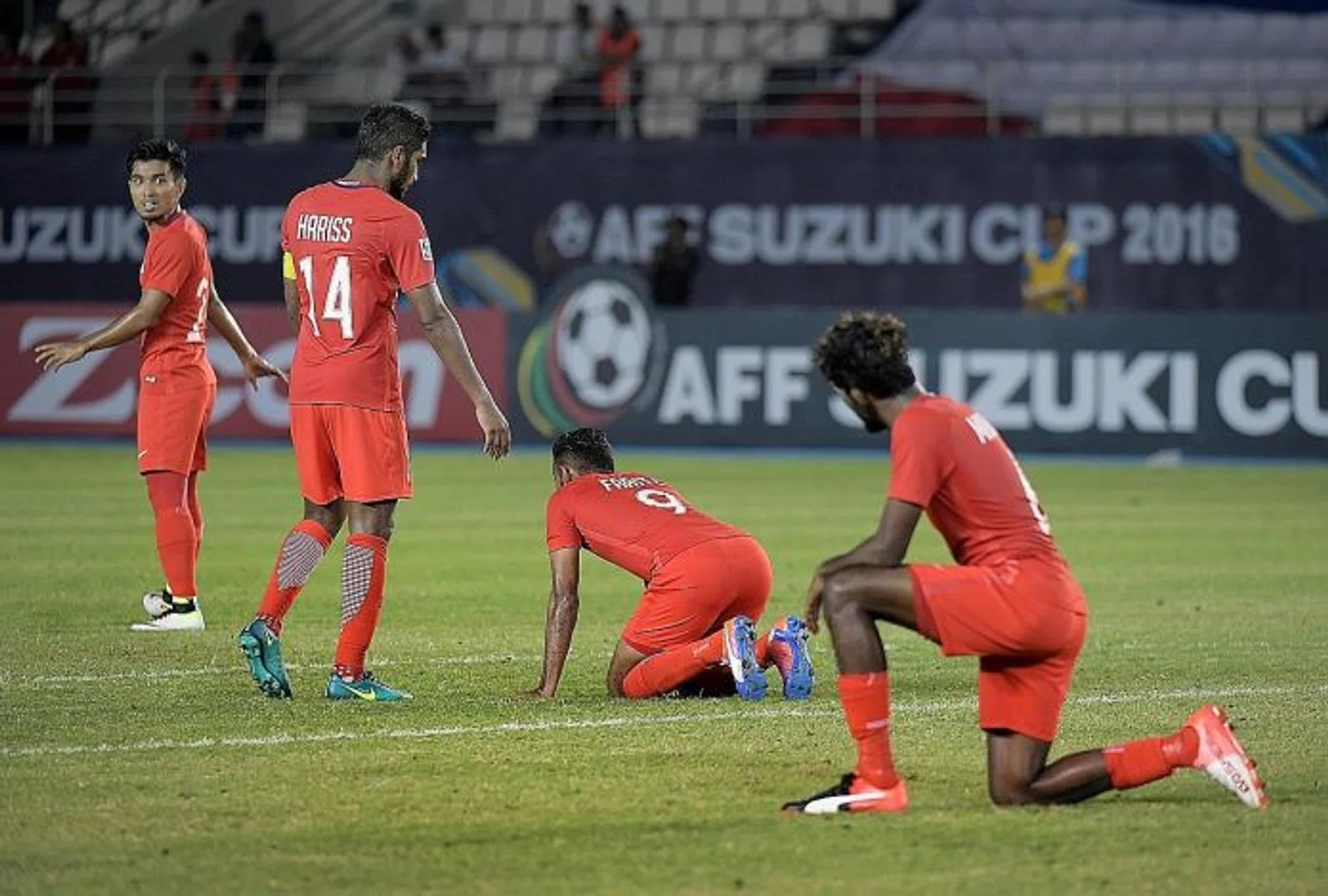COME ON: Lions captain Hariss Harun (No. 14) rallying his troops during this year's Suzuki Cup, where Singapore recorded their worst showing in history.