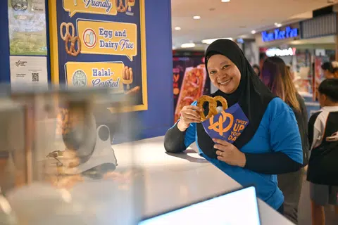 Ms Suriyati Karsan, now working as a baker at Auntie Anne's, is a beneficiary of a confidence-building, job readiness programme at Daughters Of Tomorrow.