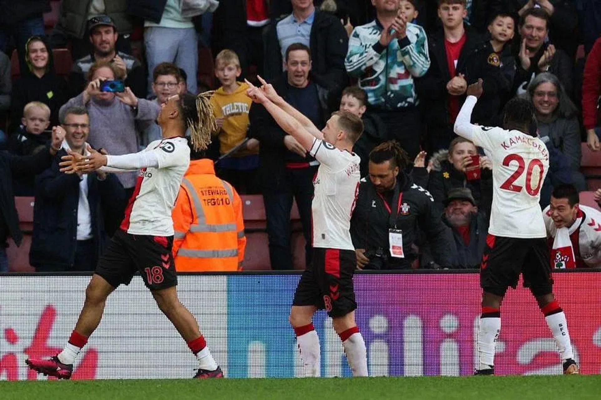 Southampton's James Ward-Prowse celebrates with teammates after scoring the equaliser from the penalty spot. PHOTO: AFP
