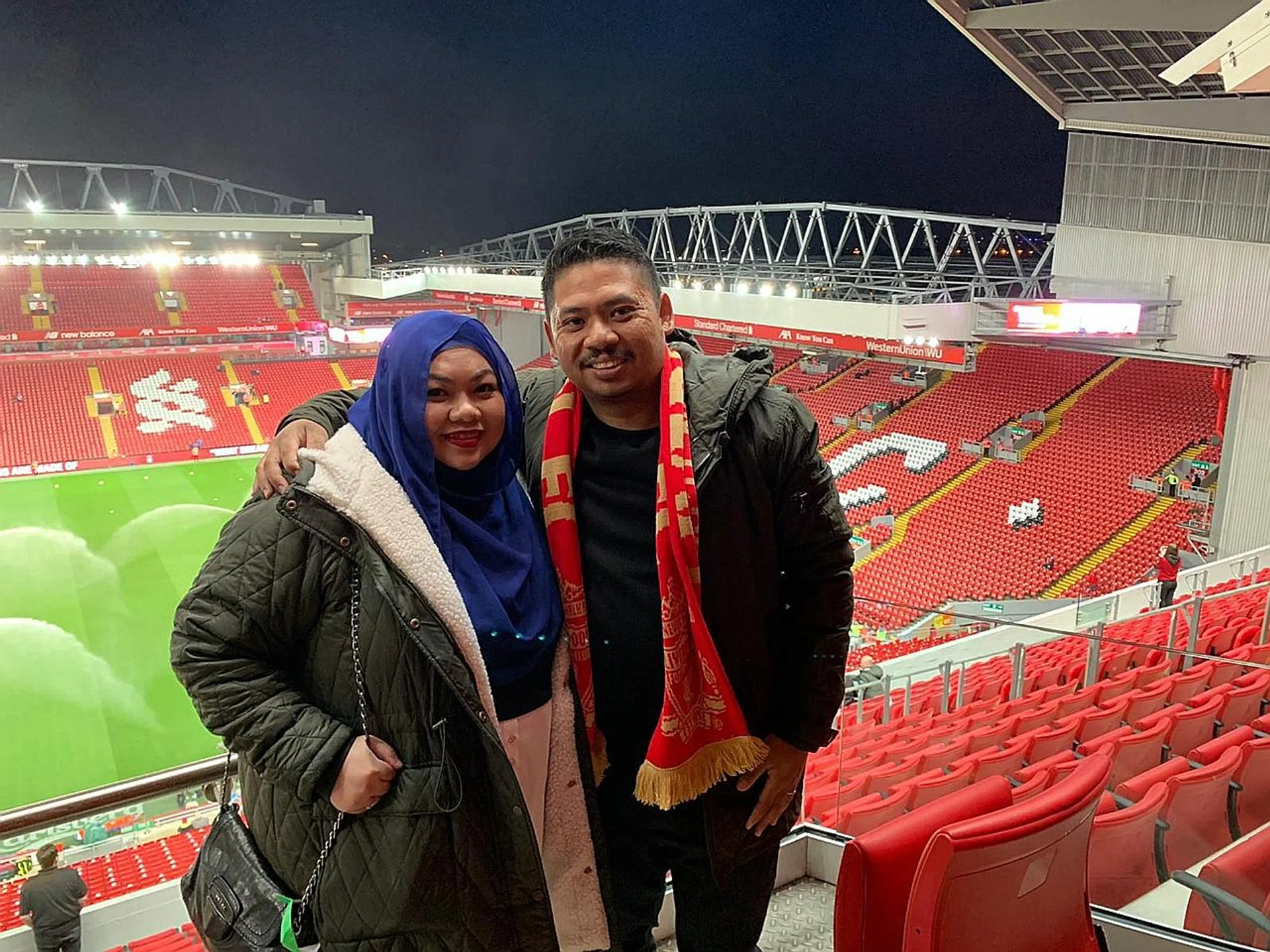 Liverpool fans Nurazila Suparman (left) and Muhammad Syahril at Anfield. 
