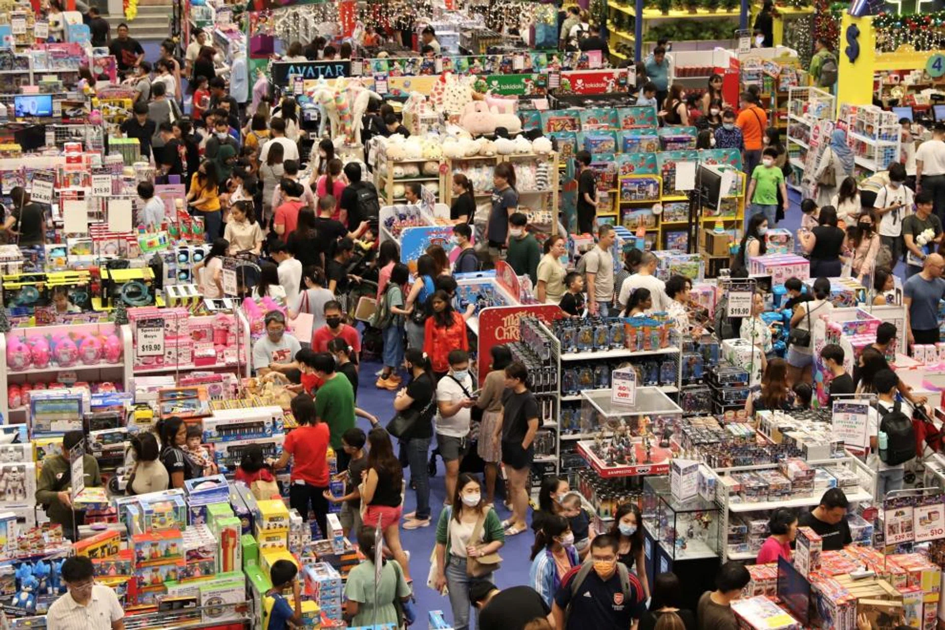 Shoppers browse merchandise in a shopping mall on Orchard Road, in Singapore on Dec 23, 2022. 