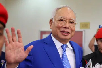 Najib Razak's jail term halved, fine reduced