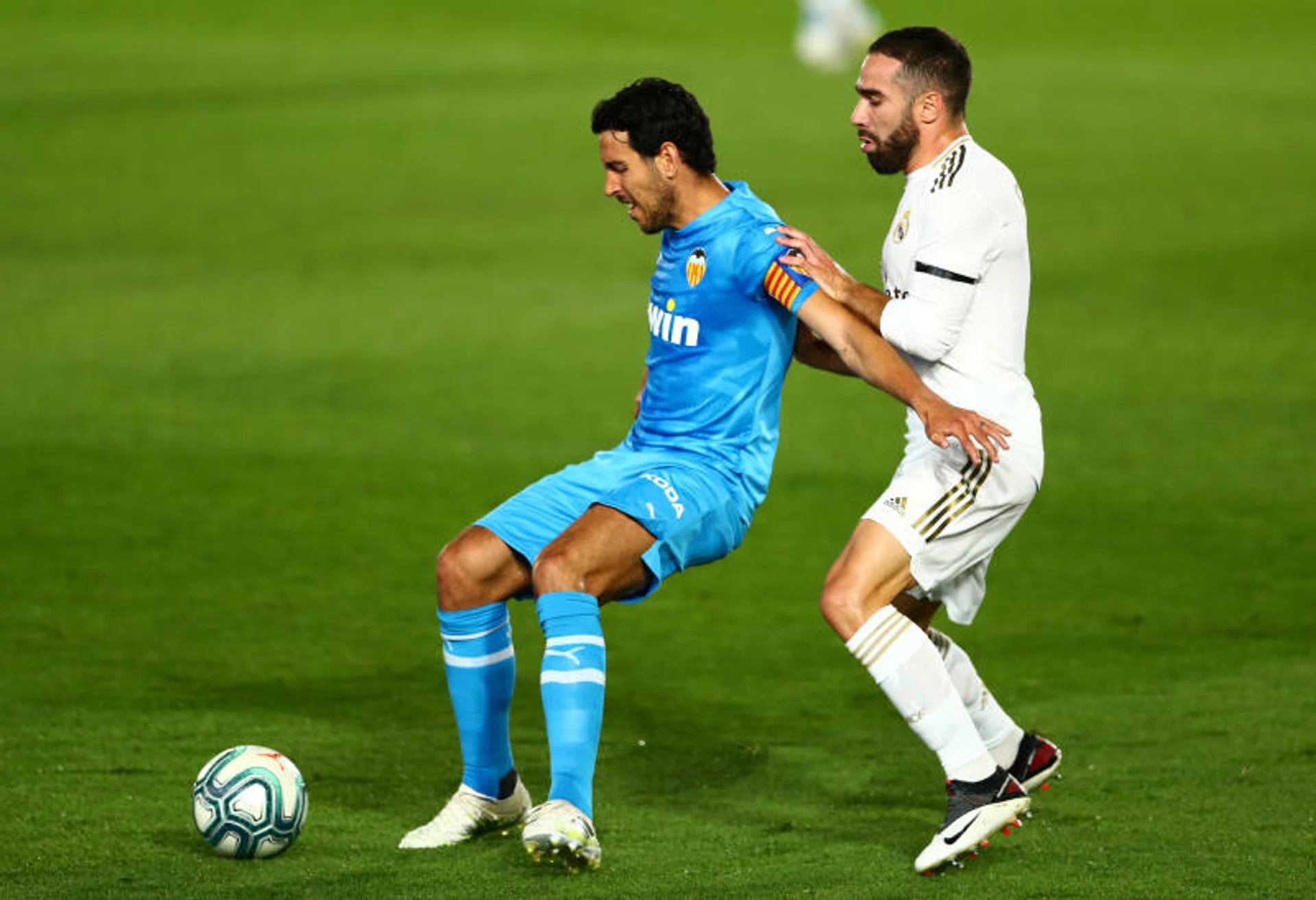 Former Valencia captain Dani Parejo (left) has been sold to local rivals Villarreal. 