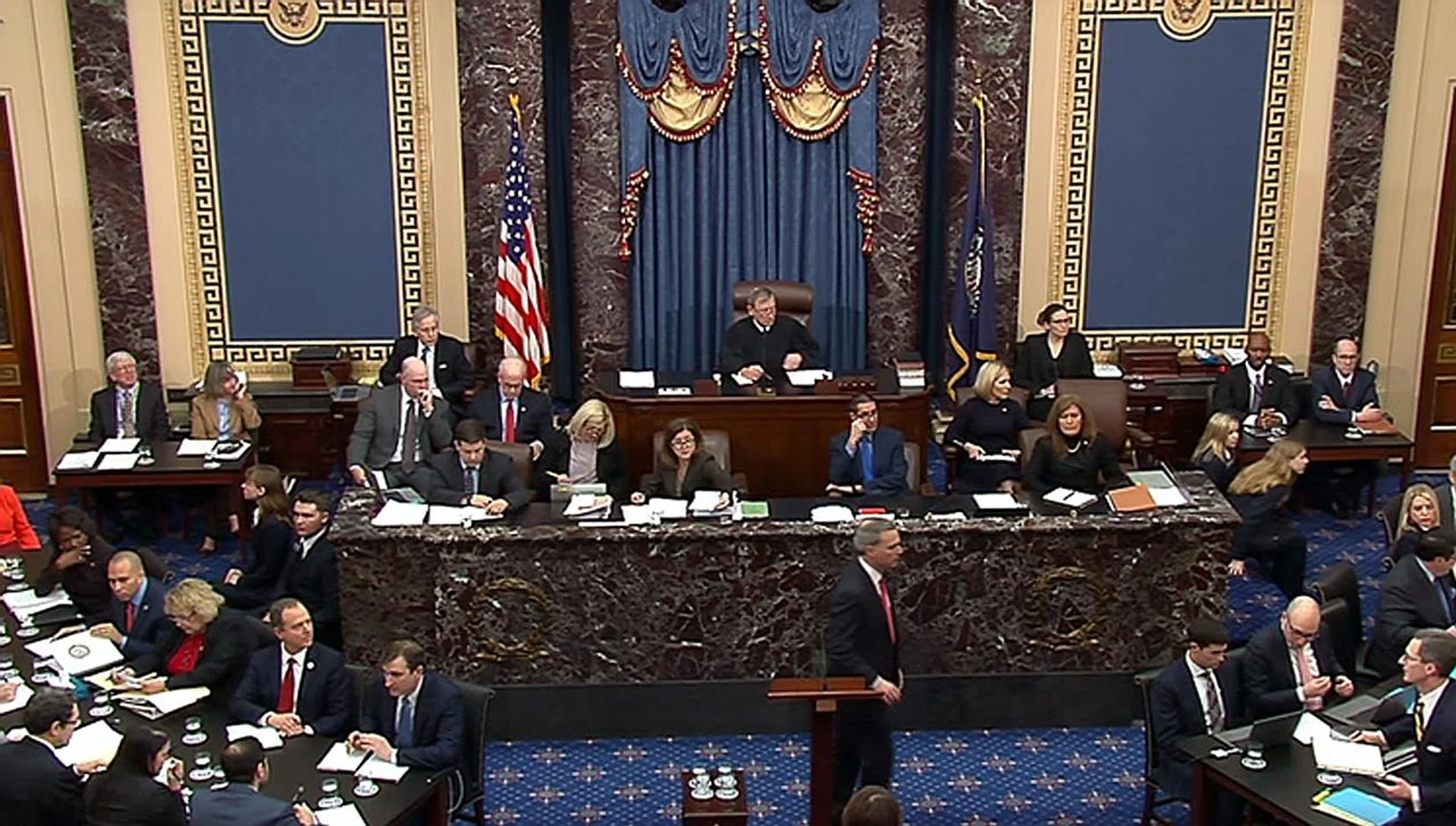 US Supreme Court Chief Justice John Roberts (centre, seated) presiding over the impeachment hearings.