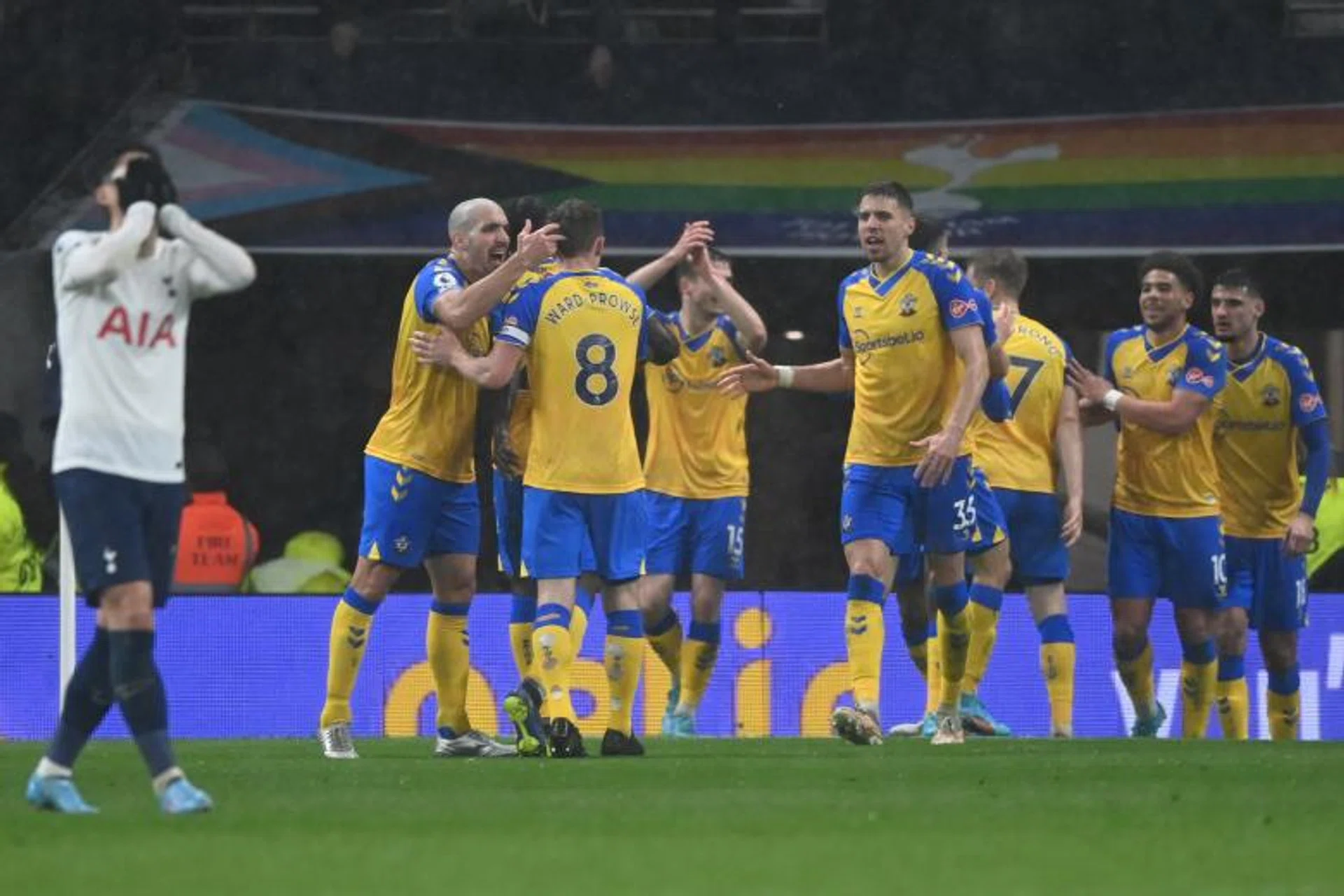 Tottenham's Son Heung-Min reacts as Southampton celebrate scoring their third goal.

