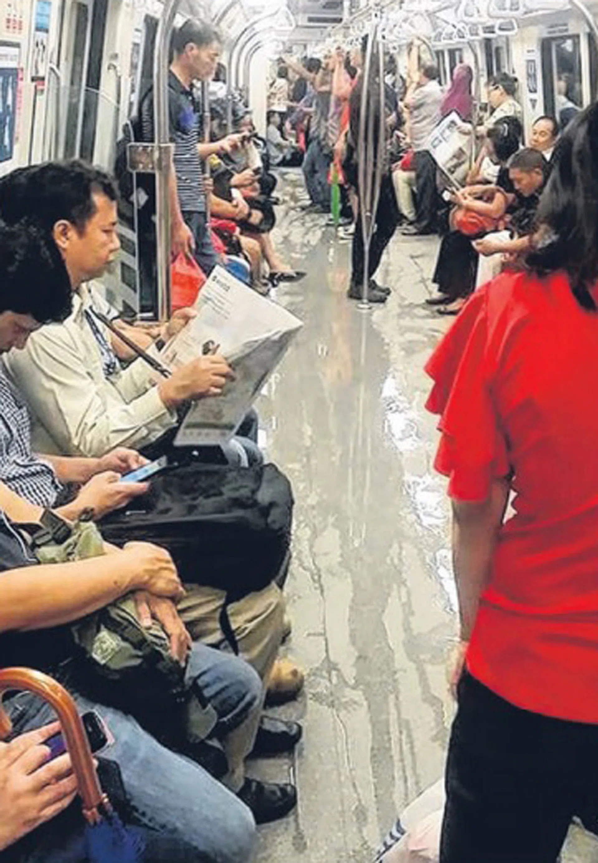 WET: Rainwater flowed into train cabins, wetting the floors. 