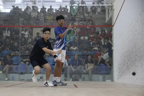 Ethan Tan (left) plays against Richard Allan Durrani (right) in the second match of the final.