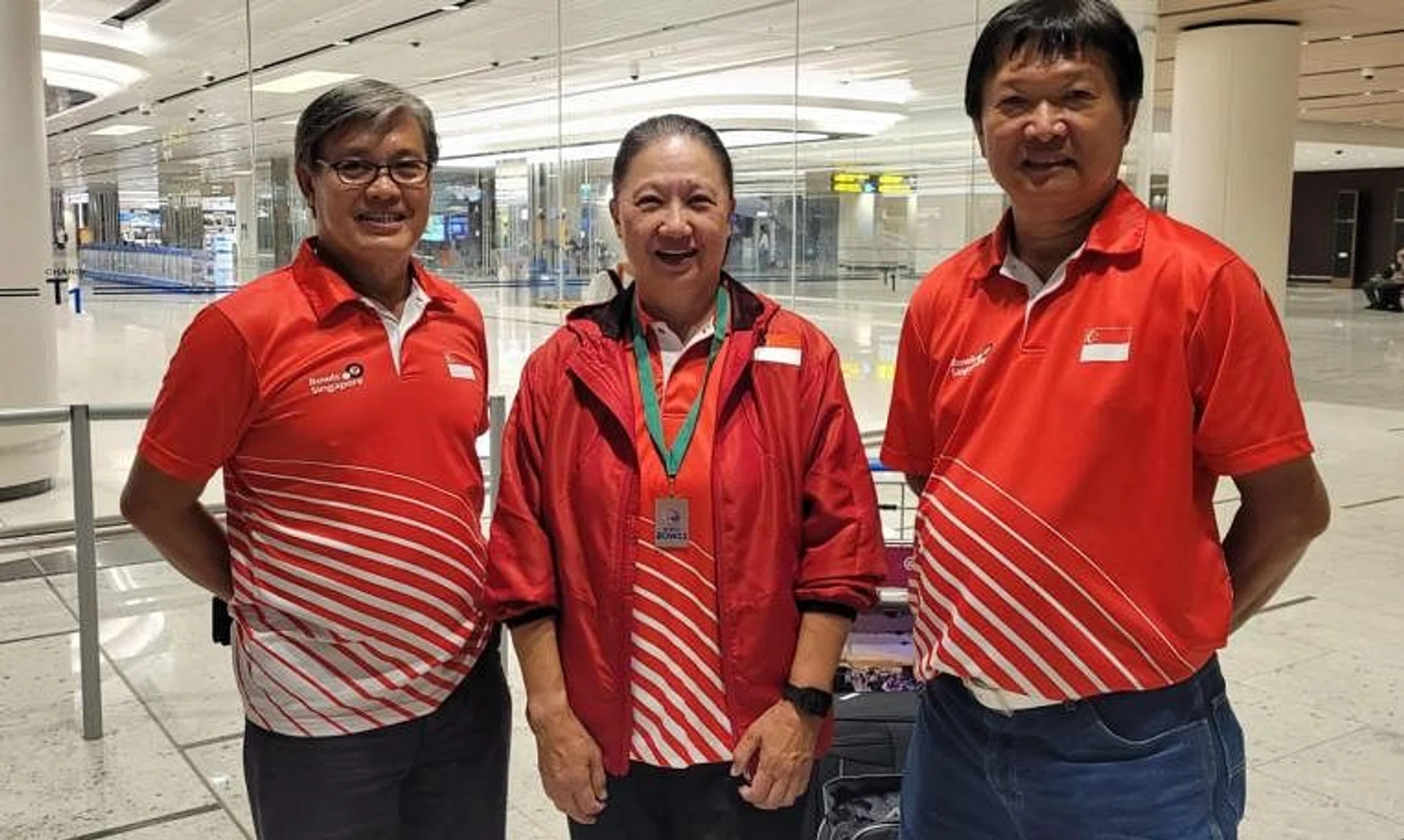 (L-R) Singapore bowls coach Bernard Foo, Bronze medallist Philomena Goh, Singapore male bowls player Anthony Loh, returning from Gold Coast, Australia after competing at the World Bowls Champion of Champions.