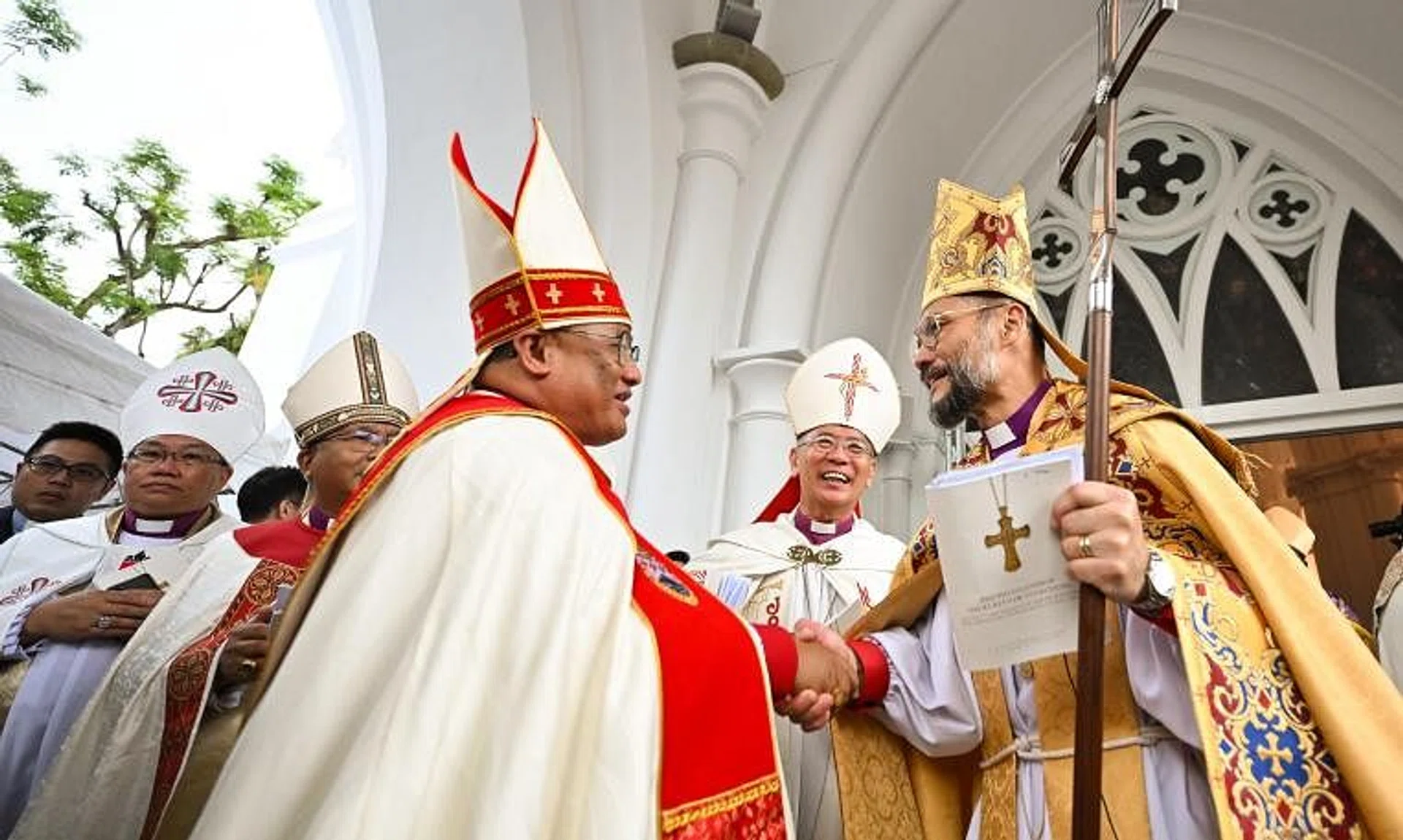 Archbishop Titus Chung (right) is the third Singaporean to have taken on the role since the province was formed in 1996. He is pictured shaking hands with Bishop of Sabah Melter Tais.