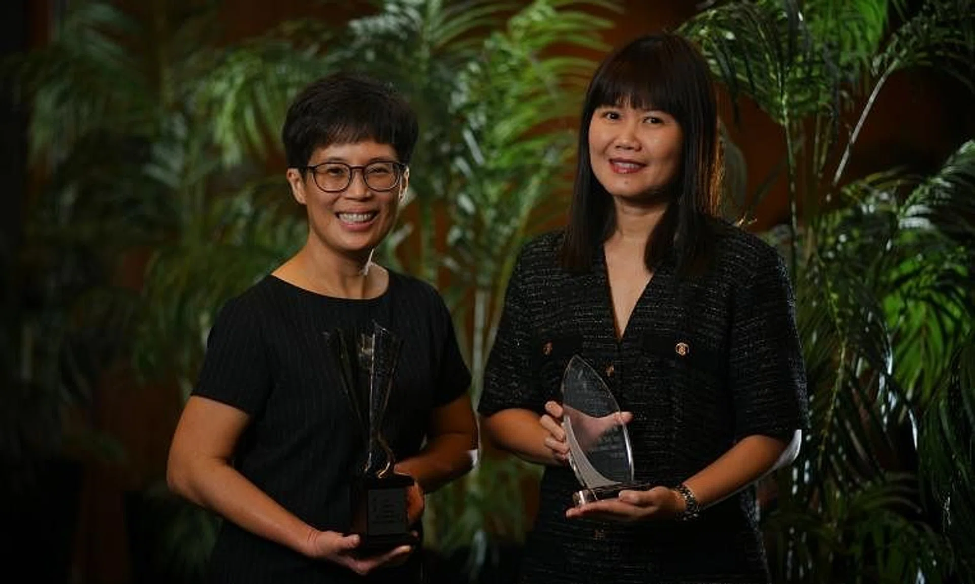 ST Senior Business Correspondents Chor Khieng Yuit (left) and Joyce Lim win the Investor Education Journalist of the Year and Special Award respectively.