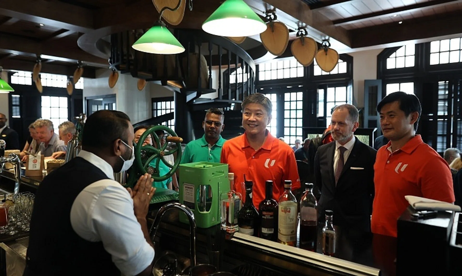 NTUC secretary-general Ng Chee Meng (centre) and NTUC deputy secretary-general Desmond Tan (right) at the Long Bar, Raffles Hotel Singapore on Nov 6. 