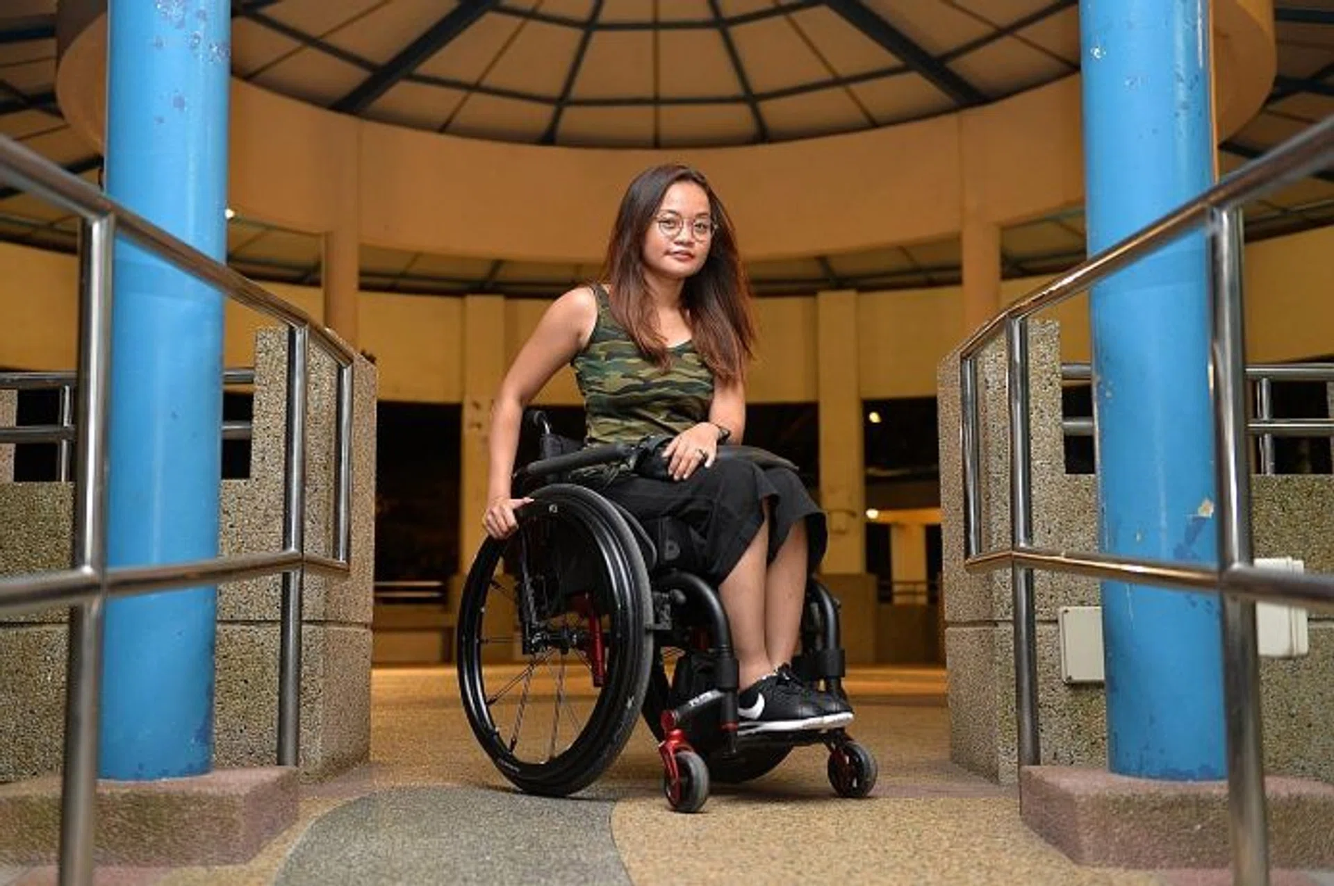 LIFE-CHANGING: Ms Azlin Amran fell into a gap in an escalator more than three years ago. She is now wheelchair-bound.