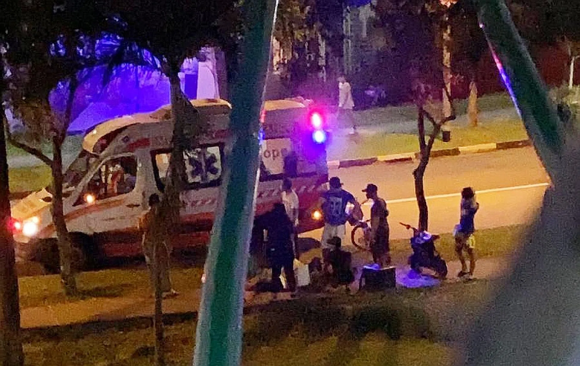 Paramedics tending to the cyclist, who was taken concious to Khoo Teck Puat Hospital. 