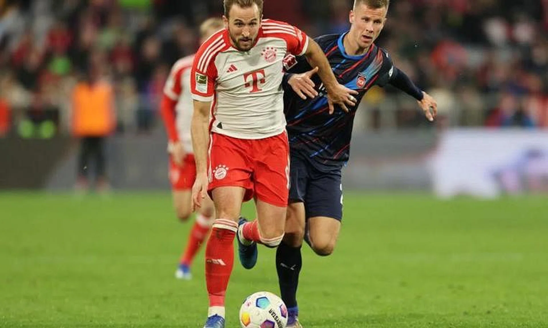 Soccer Football - Bundesliga - Bayern Munich v 1. FC Heidenheim - Allianz Arena, Munich, Germany - November 11, 2023 Bayern Munich's Harry Kane in action with 1. FC Heidenheim's Adrian Beck REUTERS/Leonhard Simon/  File Photo