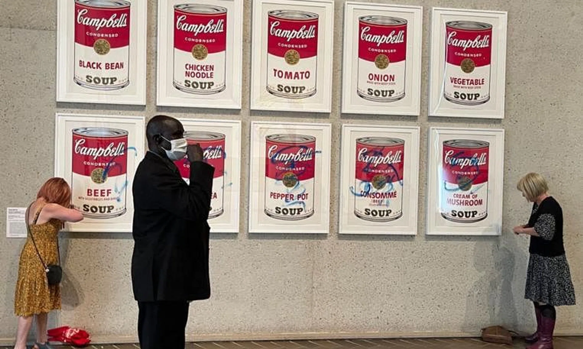 Several blue scrawls were also seen across the series of ten paintings, which are behind glass. 