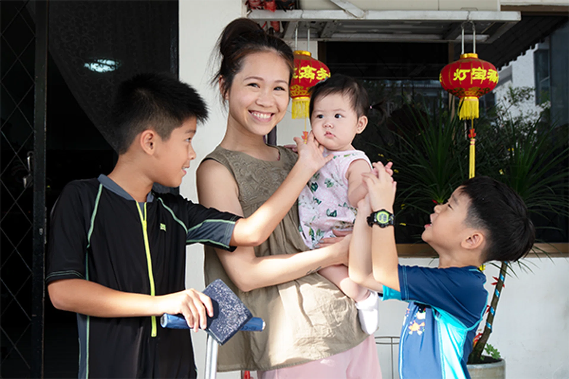Joyce with her three children (from left) Caden, Alessa, and Caius.

