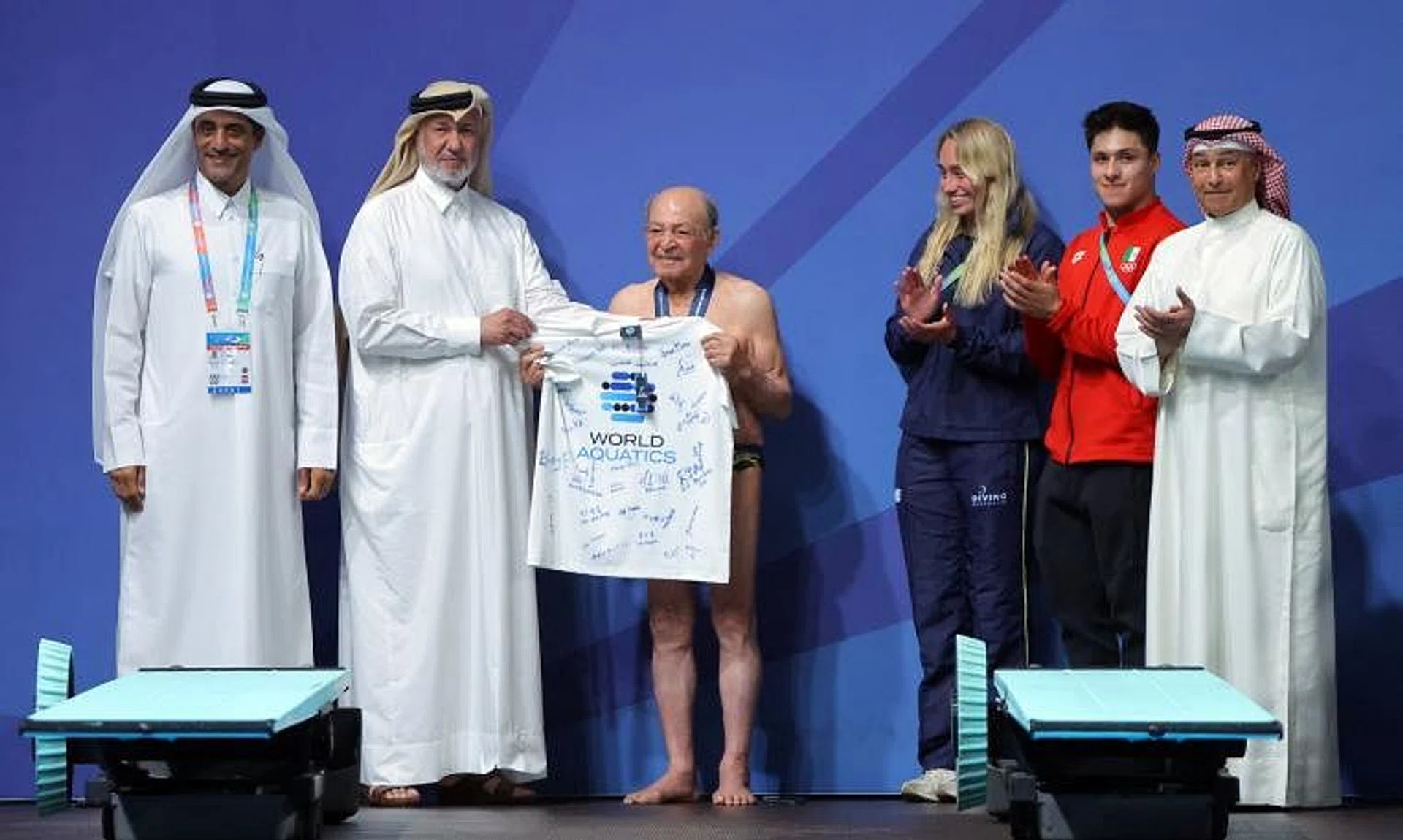 Mr Taghi Askari (centre) after performing his dive at the World Aquatics Championships in Doha on Feb 9.  